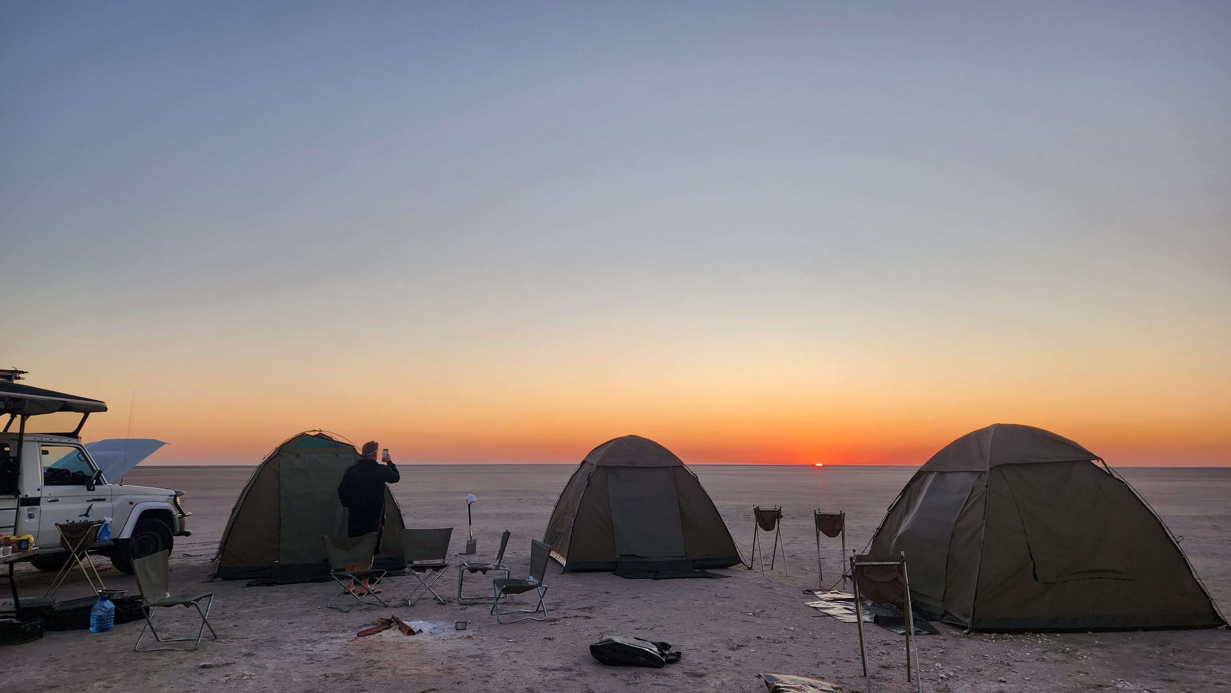 Camping set up on an open plain.