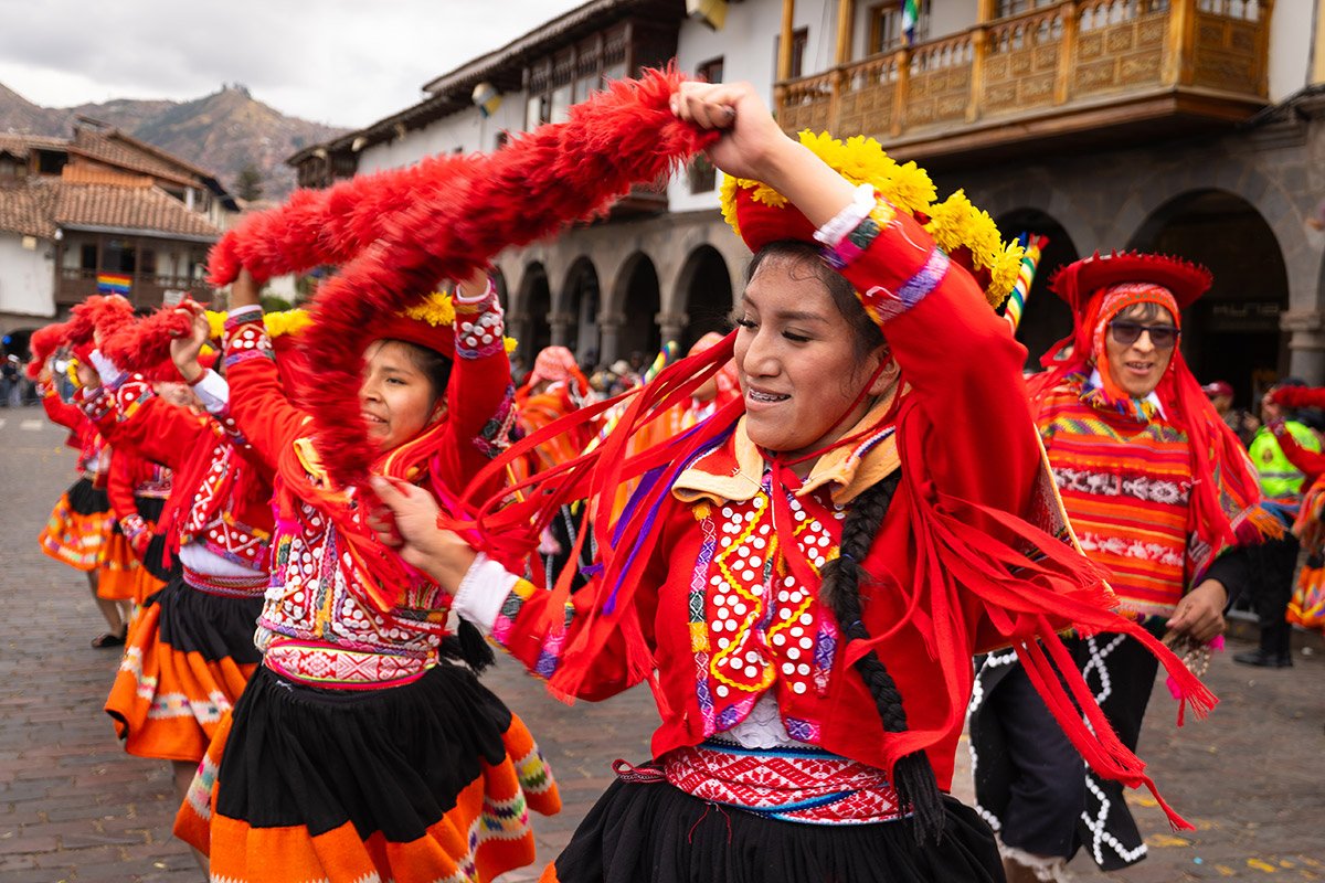 Dancers performing during the carnival parade in Cuzco, Peru.