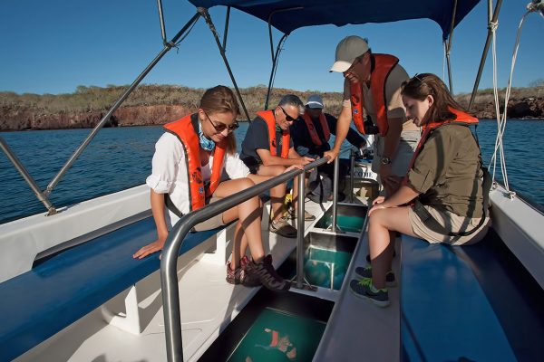 Passengers on a glass bottom boat, Galapagos Islands Passengers on a glass bottom boat, Galapagos Islands